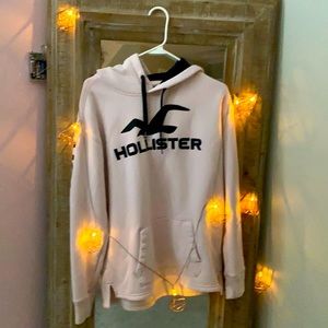 This is a light pink small holister hoodie
